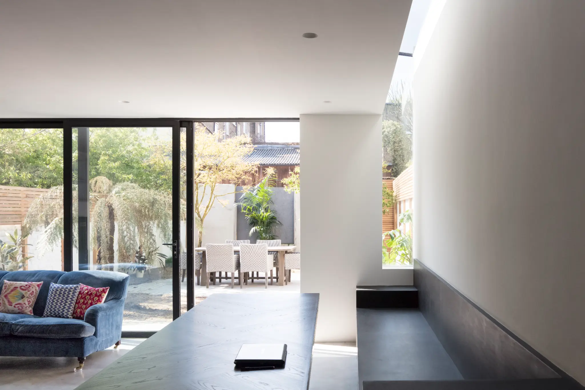 Open-plan space to garden showing innovation, daylight, and indoor-outdoor sustainability