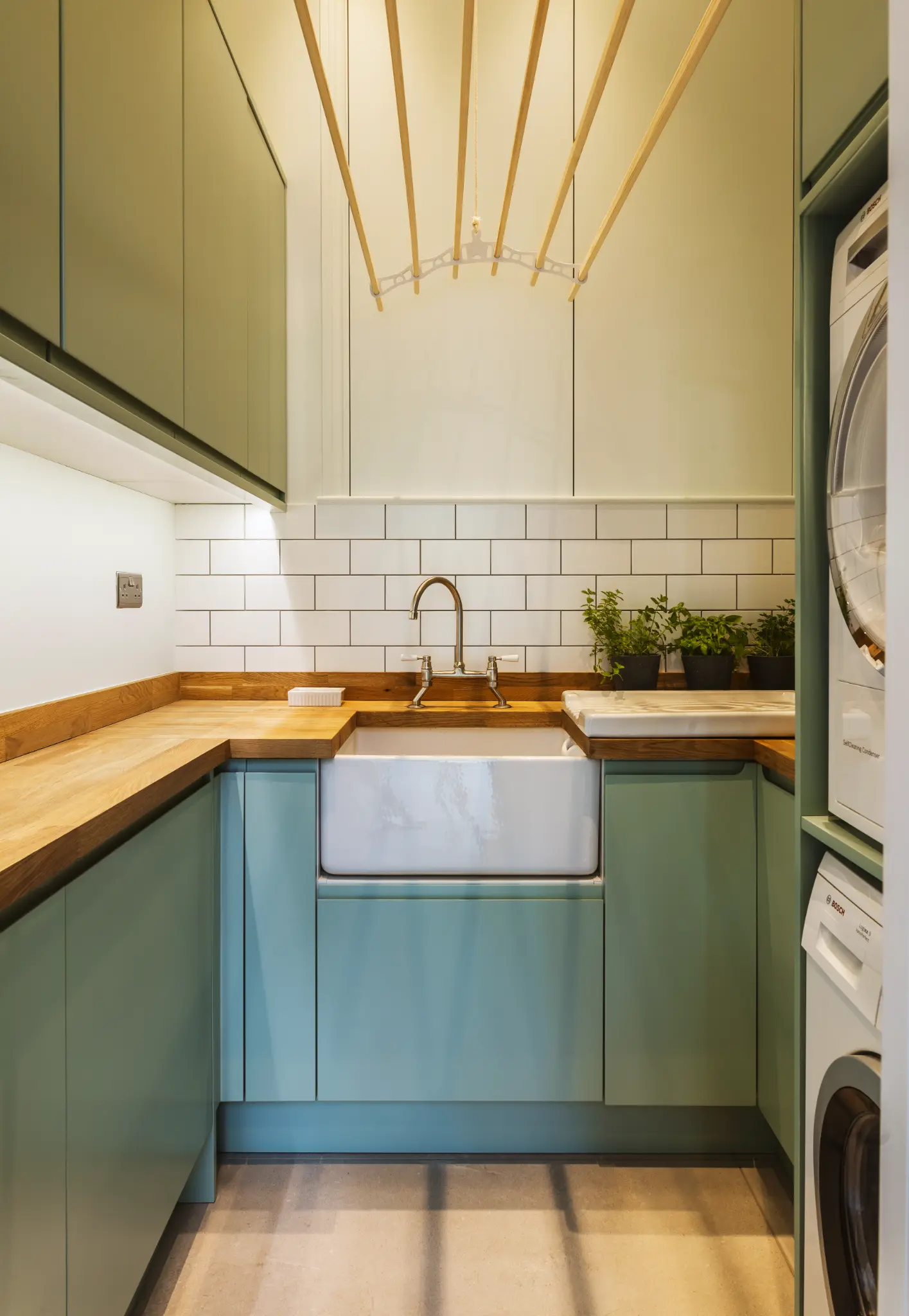Utility room with oak counters and ceramic sink to support durable, low-embodied-carbon materials